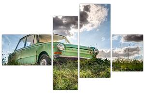 Obraz zeleného auta v tráve (Obraz 110x70cm)