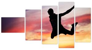 Obraz skákajúceho muža (Obraz 110x60cm)