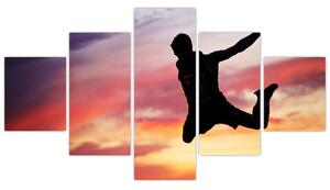 Obraz skákajúceho muža (Obraz 125x70cm)