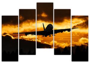 Pristávajúce lietadlo pri západe slnka - obraz (Obraz 125x90cm)