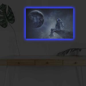 Wallity Obraz s LED osvetlením ASTRONAUT VO VESMÍRE II 45 x 70 cm