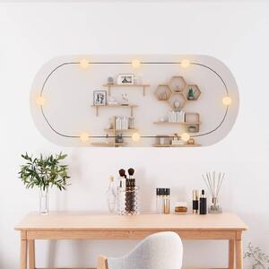 Nástenné zrkadlo s LED svetlami 45x100 cm sklo oválne
