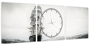 Obraz - Loď plávajúca po oceáne (s hodinami) (90x30 cm)