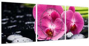 Obraz - Ružové orchidey s palmovým listom (s hodinami) (90x30 cm)