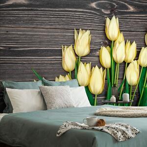 Samolepiaca fototapeta žlté tulipány na drevenom podklade