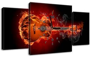 Obraz s hodinami Horiaca gitara - 3 dielny Rozmery: 100 x 70 cm