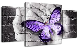 Obraz s hodinami Fialový motýľ na dlaniach - 3 dielny Rozmery: 80 x 40 cm