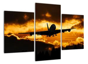 Pristávajúce lietadlo pri západe slnka - obraz (Obraz 90x60cm)