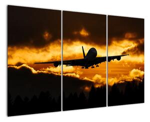 Pristávajúce lietadlo pri západe slnka - obraz (Obraz 120x80cm)