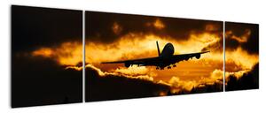 Pristávajúce lietadlo pri západe slnka - obraz (Obraz 170x50cm)