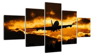 Pristávajúce lietadlo pri západe slnka - obraz (Obraz 125x70cm)