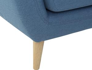 Kreslo modré prešívané operadlo nohy zo svetlého dreva hrubo vystužené obývacia izba
