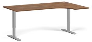 Rohový výškovo nastaviteľný stôl, 180x120 cm, 2 motory, L/P, sivá podnož, orech