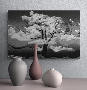Obraz čiernobiely strom zaliaty oblakmi