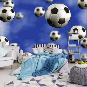 Fototapeta - Futbalové lopty na modrom pozadí (152,5x104 cm)