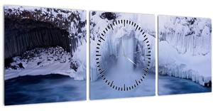 Obraz vodopádu v zime (s hodinami) (90x30 cm)