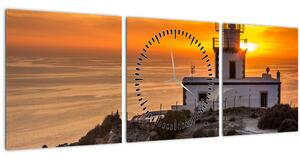 Obraz majáka pri západe slnka (s hodinami) (90x30 cm)