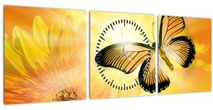 Obraz - Žltý motýľ s kvetom (s hodinami) (90x30 cm)