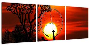 Obraz - Siluety zvierat pri západe slnka (s hodinami) (90x30 cm)