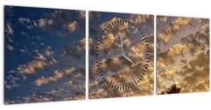 Obraz - Palmy medzi mrakmi (s hodinami) (90x30 cm)
