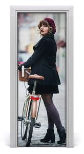 Fototapeta samolepiace dvere žena na bicykli 75x205 cm