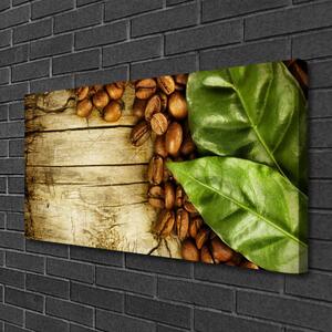 Obraz na plátne Zrnká káva listy kuchyňa 100x50 cm
