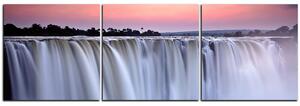 Obraz na plátne - Vodopád sfarbený západom slnka - panoráma 5227B (150x50 cm)