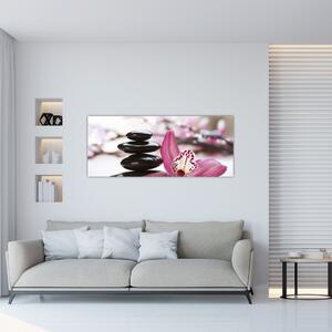 Obraz masážnych kameňov a orchidey na vode (120x50 cm)