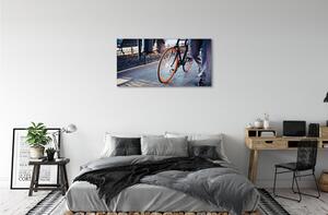 Obraz canvas Mesto na bicykli noha 100x50 cm