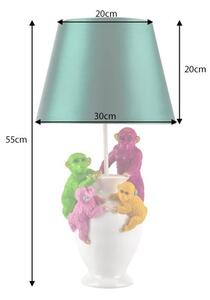 Estila Dizajnová stolná lampa Tierra Glam so zeleným textilným tienidlom a bielou podstavou s farebnými figúrami opíc 55 cm