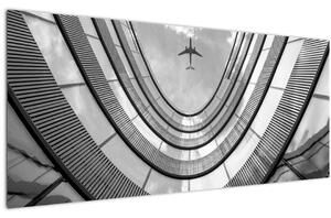 Obraz - Lietadlo nad budovou (120x50 cm)