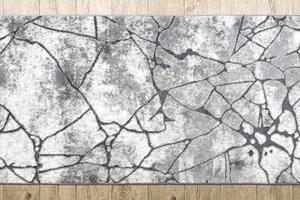Moderný behúň COZY 8873 Cracks, prasknutý betón - Štrukturálny, dve vrstvy rúna tmavosivá