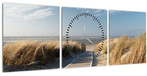 Obraz - Piesočná pláž na ostrove Langeoog, Nemecko (s hodinami) (90x30 cm)