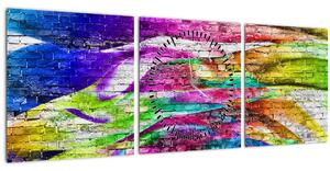 Obraz - Tehlový múr s farebnými plameňmi (s hodinami) (90x30 cm)