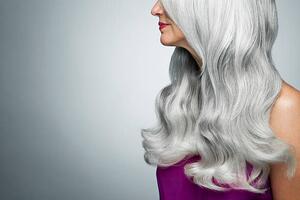 Umelecká fotografie Cropped profile of a woman with long, gray hair., Andreas Kuehn, (40 x 26.7 cm)