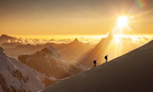 Umelecká fotografie Climbers on a snowy ridge at sunrise, Buena Vista Images, (40 x 24.6 cm)