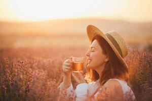 Umelecká fotografie Young happy woman drinking herbal tea,, Polina Lebed, (40 x 26.7 cm)