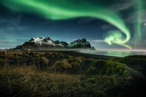 Umelecká fotografie northern lights over Vestrahorn moutain , Iceland, Peerasit Chockmaneenuch, (40 x 26.7 cm)