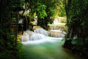 Fotografia Beautiful view of Deep forest waterfall landscape., Chanet Wichajutakul