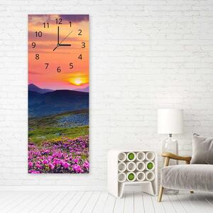 Hodiny na stenu Horská lúka pri západe slnka Rozmery: 25 x 65 cm