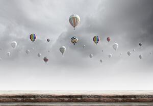 Fototapeta - Balóny nad tehlovou stenou (147x102 cm)