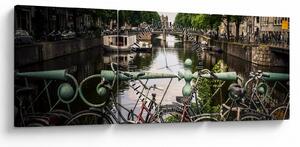 Obraz bicykla v meste (s hodinami) (90x30 cm)