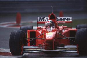 Fotografia Michael Schumacher in a Ferrari F310B at the Belgian GP, Spa Francorchamps, Belgium, 1997, (40 x 26.7 cm)
