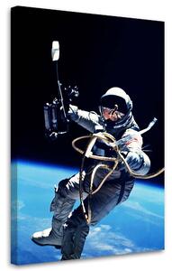 Obraz na plátne Astronaut nad zemou - Nikita Abakumov Rozmery: 40 x 60 cm
