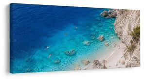 Obraz skalnaté pobrežie a azúrové more