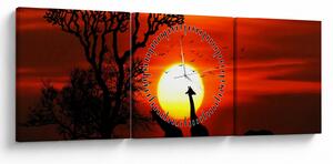 Obraz - Siluety zvierat pri západe slnka (s hodinami) (90x30 cm)