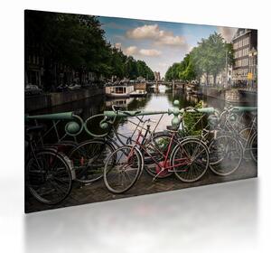 Sklenený obraz bicykla v meste (70x50 cm)