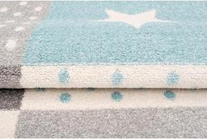 Bielo-tyrkysový koberec so vzormi