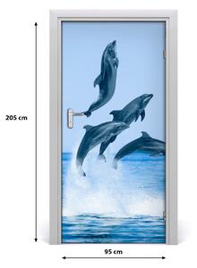 Fototapeta samolepiace na dvere skákajúci delfíny 95x205 cm