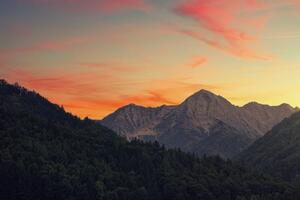 Fototapeta západ slnka na horách - 450x300